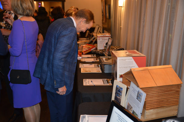 Robert Schad looking though the silent auction.