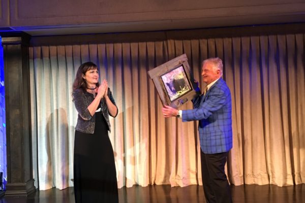 Executive Director Nathalie Karvonen presents Robert Schad with the Patron of Wildlife Award!